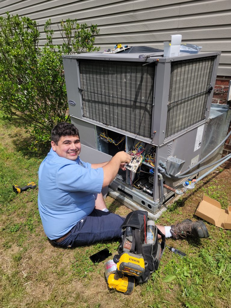 Home Town Owner Servicing a HVAC Unit